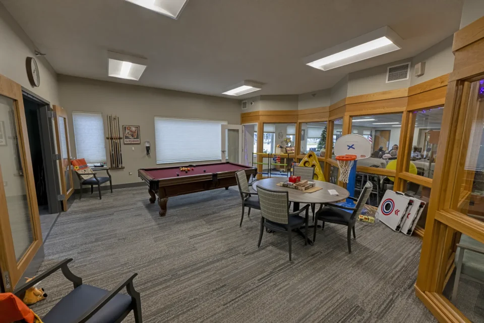 Senior social activity game room at an adult day care facility.
